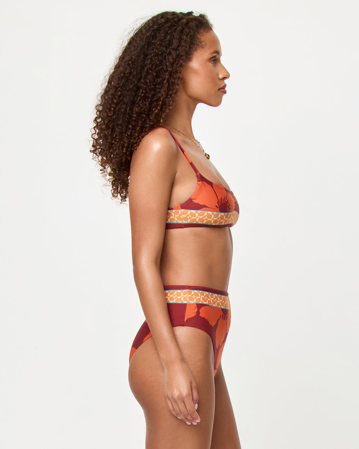 LSPACE Presley bikini top and Soleil Bikini Bottom in Cocobolo print, side view on model.